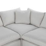 Top-down close-up on chaise corner with three back cushions converging