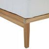 Close-up of the tapered teak sofa leg with cushion corner and visible wood grain