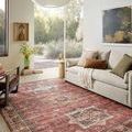 Anniston Spice rug styled in a bright living room with beige sofa, pillows, and floor-to-ceiling window