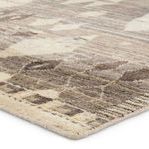 Close-up of thick handknotted pile highlighting soft texture and gray-cream tones