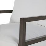 Close-up on armrest corner and cushion fabric texture in white