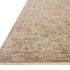 Close-up angled view showing textured low pile and detailed floral pattern of the rug