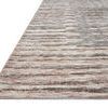 Angle view showing rug's low profile and texture with blush and taupe horizontal striations