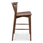 Side angle showing slim leg profile with crossbar footrest and seat curve