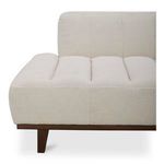 Close-up showing tapered wood leg and fabric upholstery stitching on the seat side