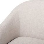 Close-up of fabric upholstery on armrest and seat junction showing tight weave