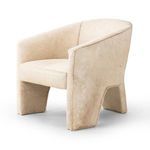 Three-quarter angle showing chair’s rounded shape and continuous hair on hide covering