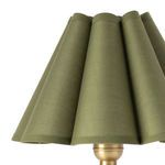 Close-up on green scalloped fabric shade showing texture and stitching detail