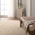 Room corner with rug under soft window light, neutral furniture, natural decor and textured ceramic vase