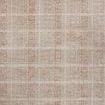 Modern flatweave area rug with a sand and clay plaid pattern creating cozy texture and depth
