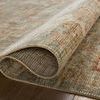 Folded over corner of Heritage Aqua Terracotta Rug highlighting thickness and soft pile on wood floor.