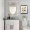 Grace Cottage Wall Mirror styled in a bathroom with white vanity, patterned grey wallpaper, and floral wall art