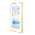 Side angled view of framed photograph with natural wood frame showing its depth and thin profile