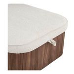 Close-up of ottoman’s oatmeal fabric top with edge piping and attached fabric loop handle