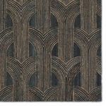 Close-up showing detailed geometric arch pattern with slate background and taupe lines