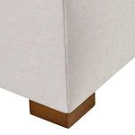 Close-up of espresso-finished wooden block foot highlighting fabric texture