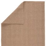 Folded corner exposing the reverse side with alternating stripe weave pattern of the rug