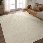 Cream Timandra rug styled in living room with caramel leather sofa and sheer curtains