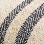 Close-up showing textured woven fabric and charcoal herringbone stripe pattern on Brett lumbar pillow