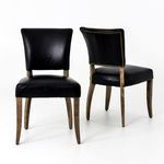 Two Mimi Rider chairs from front and back angles showing curved silhouette and wood legs on white background