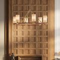 Chandelier suspended above dining area with wooden panel wall and sculptural decor