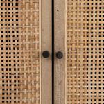 Close-up of black round metal knobs on cane framed doors of Carmel Cane Sideboard