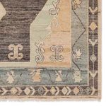 Zoomed in corner showing intricate pattern and soft color transitions in Bhima rug border