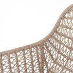 Detailed view of top edge and weaving pattern of rounded wicker backrest