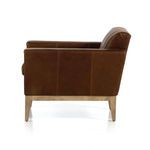 Left side profile showing clean armrests and smooth leather upholstery with wooden base.