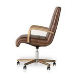 Stylized lifestyle shot with chair positioned in warm-toned modern office setting.