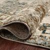 Rolled corner of rug revealing dense polypropylene pile and backing texture