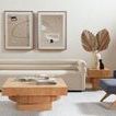 Living room setting with Leland End Table, modern coffee table, beige sofa, and artwork