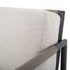 Close-up of off-white cushion fabric and wrapped shale rope on chair armrest with matte Graphite frame