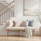 Lawrence Bench styled in a bright room with staircase, decorated with pillows and a throw on the cushion