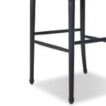Close-up of lower black ash legs and footrest bars with rounded leg bottoms