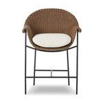 Outdoor counter stool with curvy woven frame, rolled arms, black iron base, and cream upholstered cushion