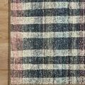 Close-up of Humphrey Plum rug corner showing detailed edge binding and plush weave