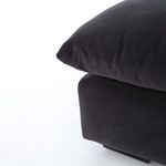 Backside view of Grant sectional showing smooth fabric panel covered back without visible frame