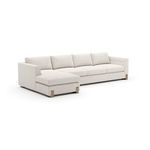Left chaise sectional sofa with plush cream textured upholstery, clean lines, low profile, and oak block feet