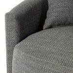 Fabric close-up of tweed-like texture and stitching on backrest curve