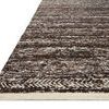 Side angle showing the rug’s low pile thickness and detailed herringbone border pattern in mocha and ivory