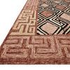 Side angle showing thick wool pile and textured surface of Nala Rose black wool rug
