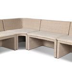 Side angle showing woven rattan sides and fabric cushions on outdoor bench