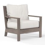 Laguna Club Chair with driftwood-finish aluminum frame and thick white seat and back cushions