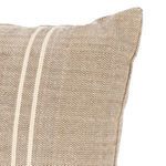 Close-up showing textured jute fibers and detailed white stripe edging on pillow corner
