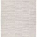 Irini handmade rug with subtle light gray, white, dark gray, and taupe stripes in a patchwork block pattern