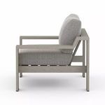 Side view of Monterey Outdoor Chair showing cushion thickness and open rectangular armrest design