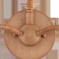 Close-up of rattan-wrapped base and mounting plate with natural wood finish