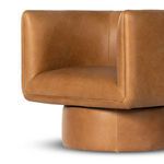 Side angle showing smooth swivel base connecting to cushioned seat