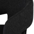 Close-up of textured polyester fabric upholstery on Anise Dining Chair armrest